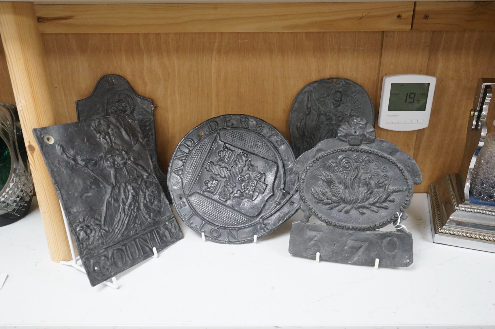 Five lead fire insurance plaques, largest 24cm